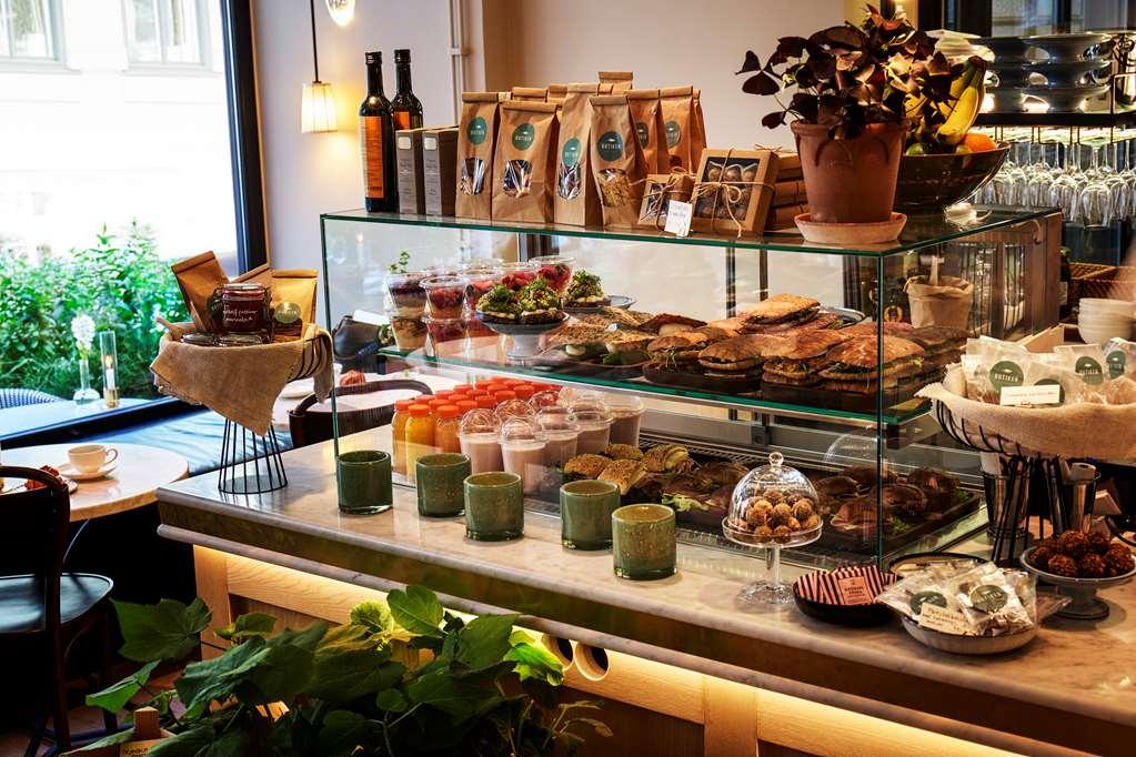 Villa Dagmar Stockholm Restaurant photo A display of coffee and pastries at a café in Stockholm, Sweden