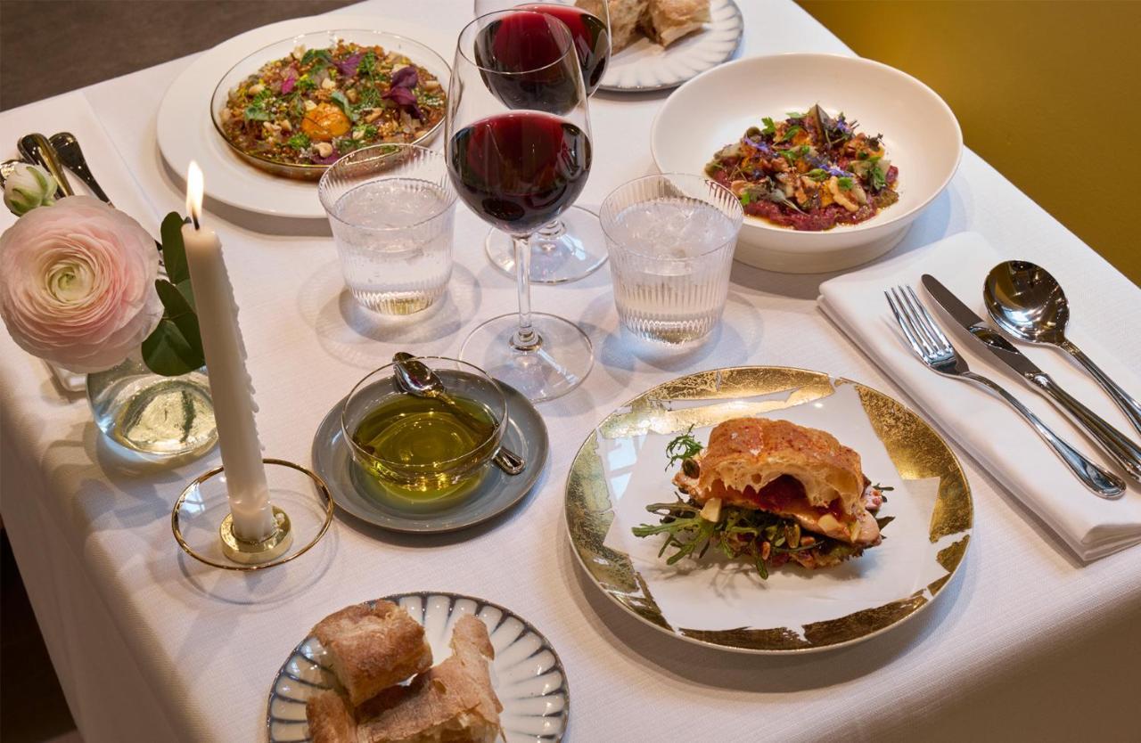 Villa Dagmar Stockholm Exterior photo A selection of dishes at the restaurant